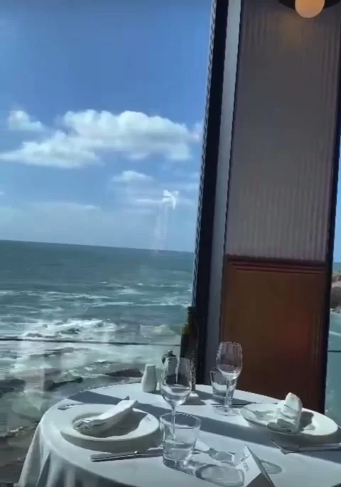 Restaurant table by the sea with ocean waves view Stock Footage 328564659