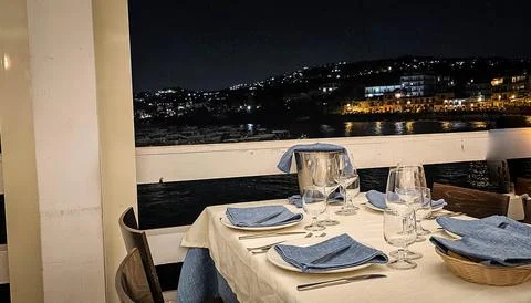 Restaurant table set for an elegant dinner Photos