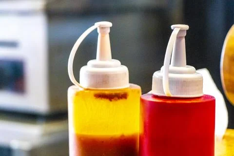 Restaurant table setting with sauces spices napkins salt pepper shakers Tha.. Stock Photos