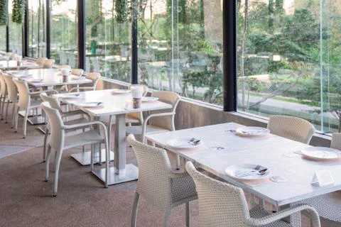 Restaurant table setting by the window Stock Photos