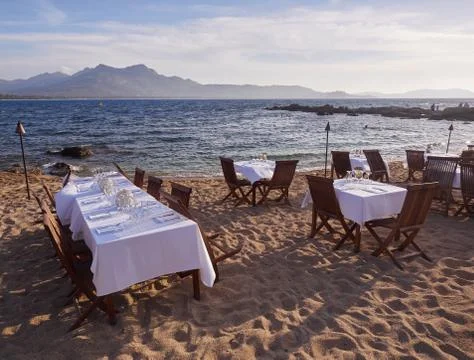 Restaurant tables at the beach Stock Photos