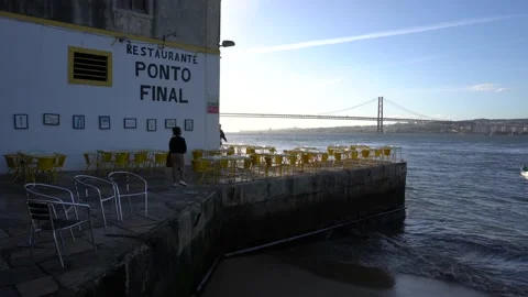 Restaurant on Tagus River Waterfront , view to Lisbon and Bridge Stock Footage 213064397