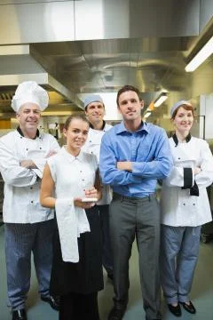 Restaurant team posing together Fotos de archivo