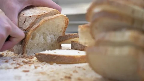 Restaurant worker preparing sliced bread for banquet appetizers Stock Footage 336793345