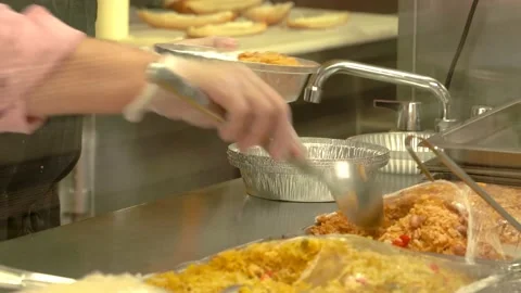 Restaurant worker serving the food on the warmer table Stock Footage 131919527