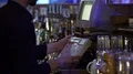 Restaurant worker typing on cash register, accepting an order from customer 4k or 4k+ Resolution