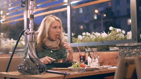 The restaurant is a young girl eats Stock Footage 68974836