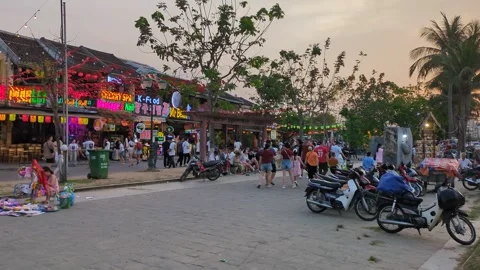 The restaurants Lights and lanterns go on in Hoi An during sunset Stock Footage 313486304