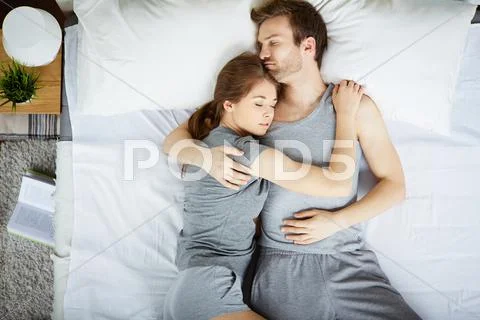 Restful couple sleeping in embrace Stock Photos