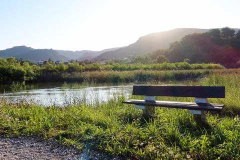 Restful River View: Bench Overlooking Mundakako Itsasadarra, Basque Country Stock-Fotos