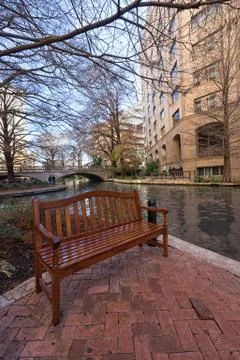 Resting bench along the famous river walk in San Antonio, Texas Stock Photos