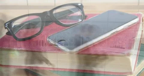 Resting black rectangular glasses and smartphone sitting on red book in study, Stock Photos