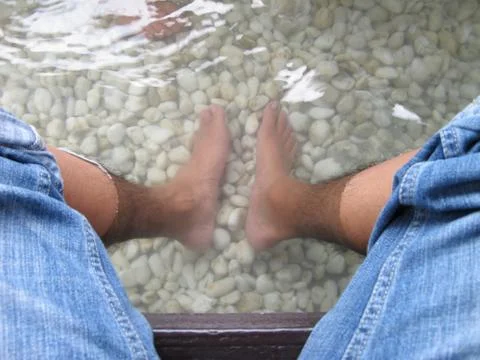 Resting feet in japanese hot spring foot bath Stock Photos