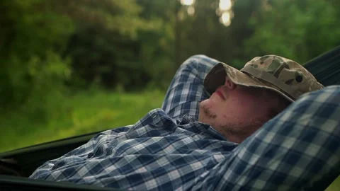 A resting man with a hat on his face Stock Footage 151481950