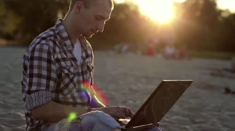 Resting Man at Sunset with a Laptop Video stock 58590983