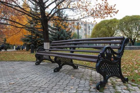 Resting place in front of a multi-storey building Stock Photos