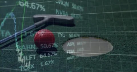Resting silver putter behind red golf ball near rimmed hole on felt mat, with Stock Photos