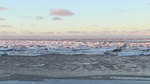 Restless drift of ice. Sea current makes a lot of floes. Tracking wide shot Stock Footage 74991339
