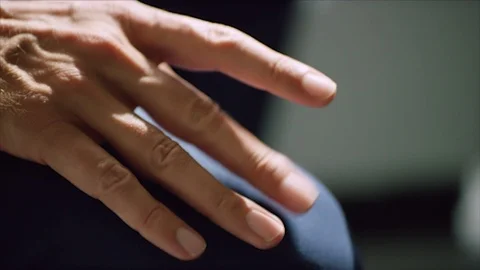 Restless hand tapping knee Stock Footage 126632779