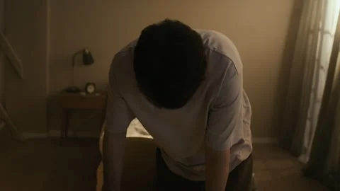 Restless Man Finding Old Photo on Messy Table and Recalling Memories in Bedroom Video stock 330660710