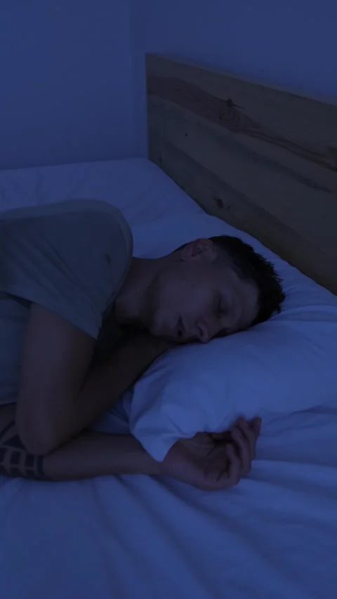Restless man tossing and turning in bed at night, unable to sleep comfortably Stock Footage 346249539