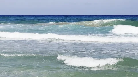 The restless sea changes its color as the waves roll in. Stock Footage 343540474