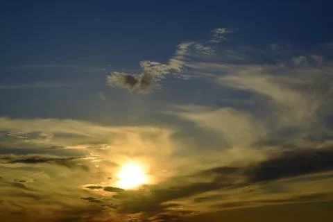 The restless sunset of the last spring day. Summer will come tomorrow. Stock Photos