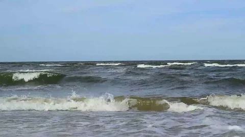 Restless waves panned distance view Stock Footage 99119292