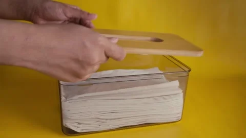 Restock tissues into tissue box or container with isolated yellow background 库存影片 269125641