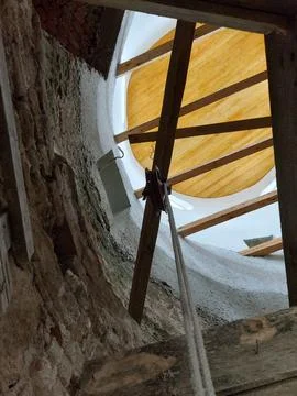 Restoration process inside an ancient monastery tower with wooden scaffolding Stock Photos