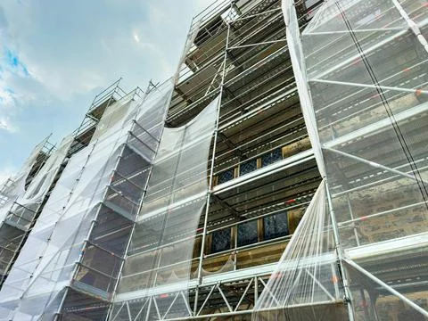 Restoration work transforms historic building as scaffolding envelops the s.. Stock Photos