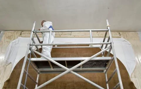 Restoration worker on a scaffold Stock Photos