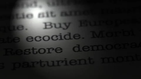 Restore democracy. Moving text printed on a page. Slow motion. Stock Footage 307286192