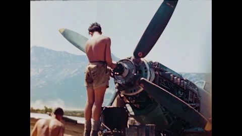 Restored WWII Ground Crew Working on Spitfire Propeller, Corsica 1944, 60FPS Stock Footage 336781548