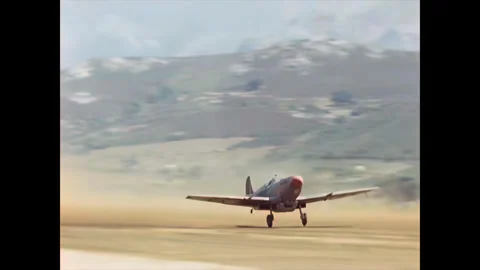 Restored WWII Pair of RAF Spitfires Taking Off, Corsica 1944 Stock Footage 336782594