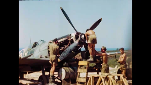 Restored WWII RAF Ground Crew Working on Spitfire Engine, Corsica 1944 Stock Footage 336782729