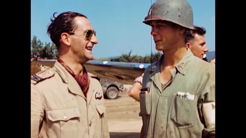 Restored WWII RAF Spitfire Pilot and U.S. Servicemen at Corsica Airfield, 1944 Stock Footage 336782803