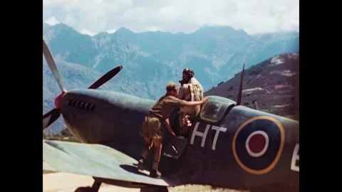 Restored WWII RAF Spitfire Pilot Entering Cockpit, Corsica 1944 Stock Footage 336782835