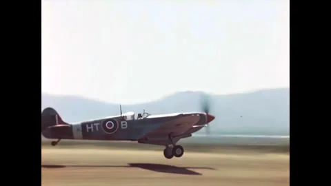 Restored WWII RAF Spitfire Taking Off From a Dirt Runway, Corsica 1944 Stock Footage 336782441
