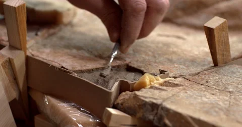 The restorer introduces the cement mortar by a small spatula into the cracks Stock Footage 119547944