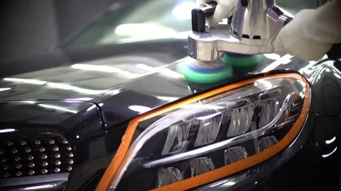 Restoring Paint of a Luxury Car through buffing machine Stock Footage 108698798