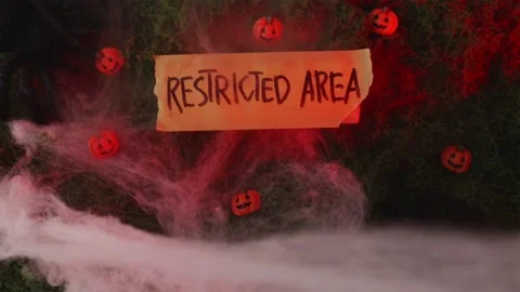 Restricted Area sign with mini pumpkins in red light fog Stock-Footage 342520284