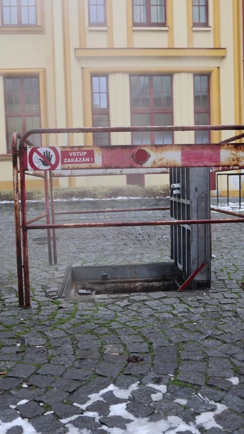 Restricted underground hatch with warning sign in urban area Stock Footage 323700797