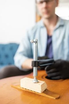 Restring classical guitar concept. The man repair an old guitar. Stock Photos