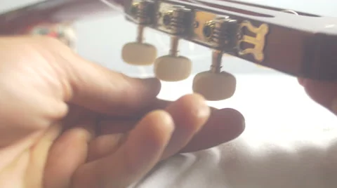 Restringing Your Classical Guitar [close up] 2 Stock Footage 68034910