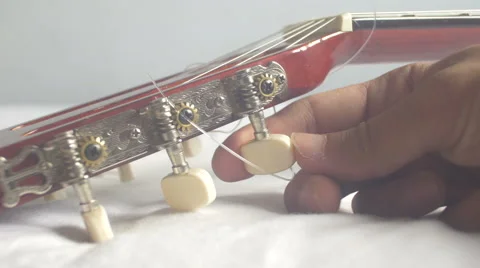 Restringing Your Classical Guitar (turning) Stock Footage 67994001
