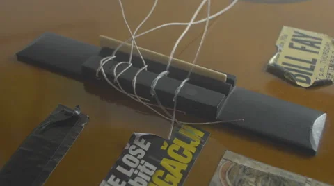 Restringing Your Classical Guitar (turning) bridge Video stock 68013009