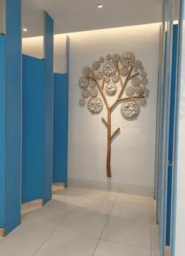 Restroom interior design decorated with creative wooden tree art on wall Stock Photos