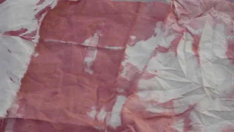 Result of tie dye technique applied to raw fabrics Stock Footage 141548075