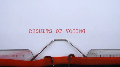 Results of voting - phrase printed on an old typewriter in red letters, close up Stock Footage 128399985